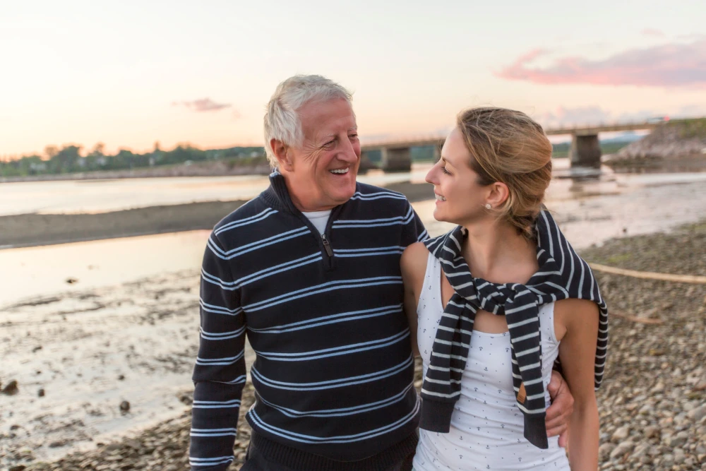 Father and daughter laughing together, showcasing humorous dad and daughter moments