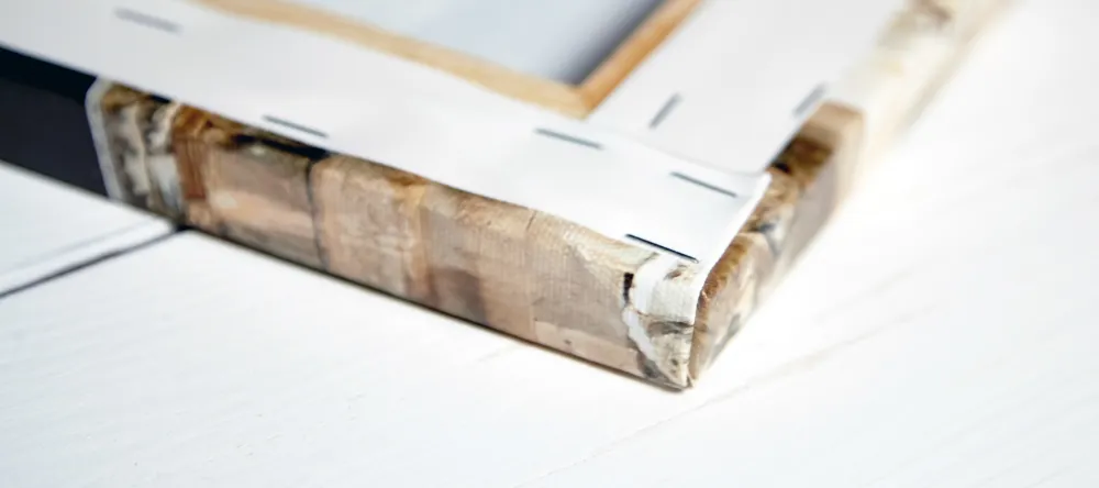 What's a gallery wrap? Canvas roll and wooden framework next to it. 