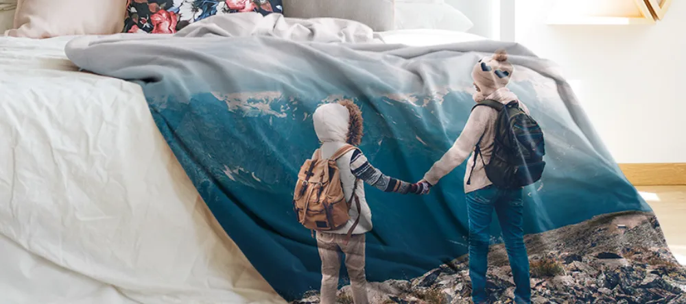 Where to create a blanket with your own picture on it. Photo blankets with two kids and mountains. 