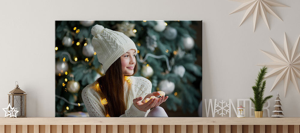 Your Essential Guide to Christmas Canvas Ideas. Photo canvas print with woman and strings lights.