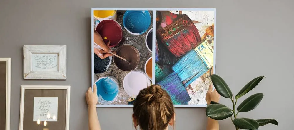  5 Easy Canvas Printing Tips for the Perfect Wall Décor. Young Lady Hanging a Canvas Print.