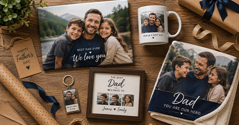 Collection of personalized Father's Day photo gifts including canvas prints, mugs, blankets and keychains arranged on a table