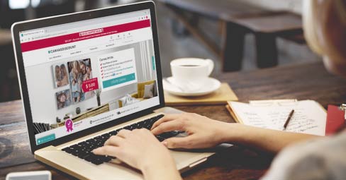 What is the Best Place to Get Canvas Prints on a Budget? Young woman looking for canvas printing service online.