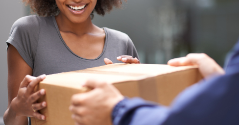 How to Get Canvas Prints with Free Shipping. Young woman receiving her photo canvas prints.