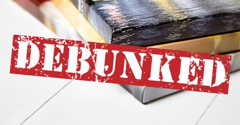Custom-Made Canvases: 10 Myths Debunked. Young couple looking for canvas prints online on tablet.