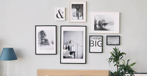 How to Make a Gallery Wall – Follow These 6 Steps. Wedding-themed gallery wall.