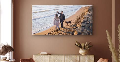 How to Print Panoramic Photos - Tips and Tricks. Panoramic canvas print with a man standing on the seashore