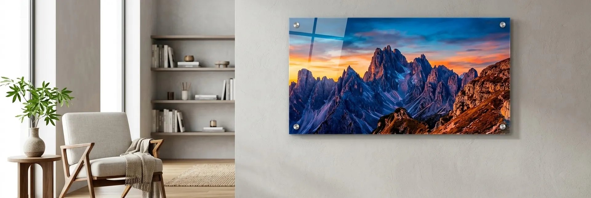 Panoramic acrylic print of jagged mountain peaks at sunset mounted on a living-room wall