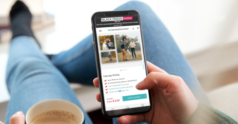 Printing Phone Photos on Canvas. Young woman online shopping on her phone.