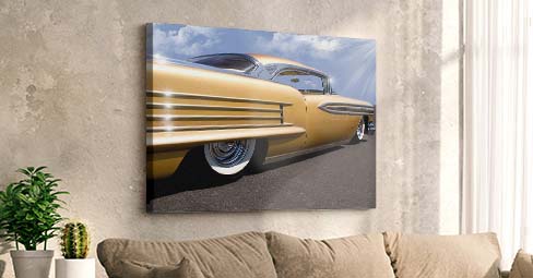 Vintage car wall art: three car prints on a bright blue wall