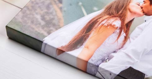 The Pros & Cons of Canvas Printing. Photo canvas print showing young lady with flowers.