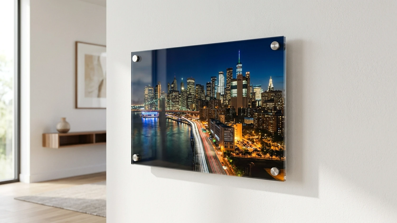 Night city skyline photo on an acrylic print with standoff mounts on a white wall