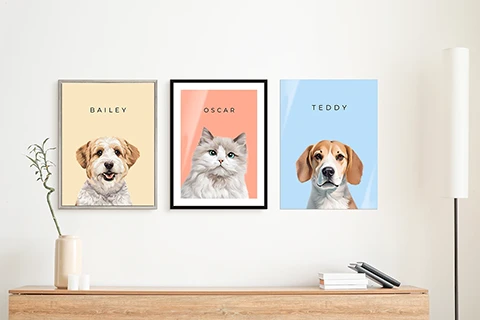 three pet portraits hung on a wall