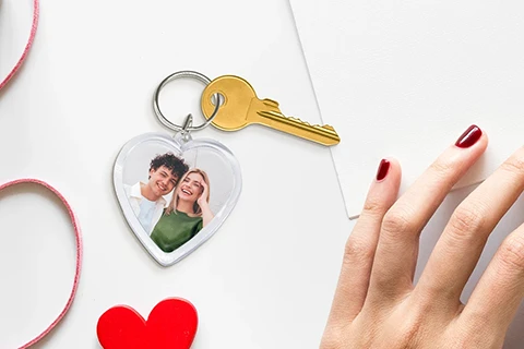 heart shaped keychain with a photo of a couple