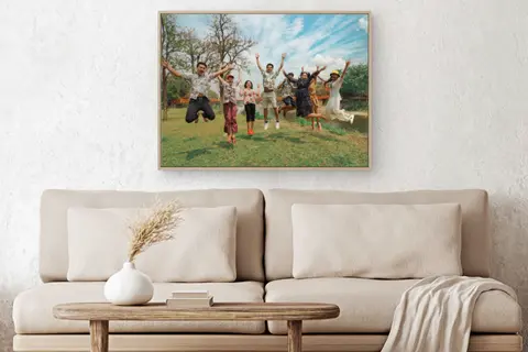 large canvas portrait over sofa