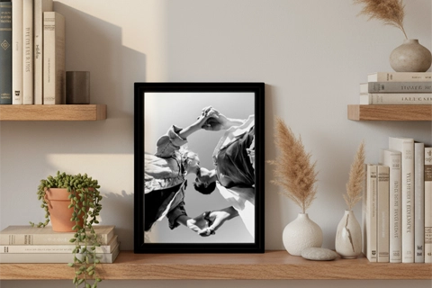 small framed canvas placed on the shelf